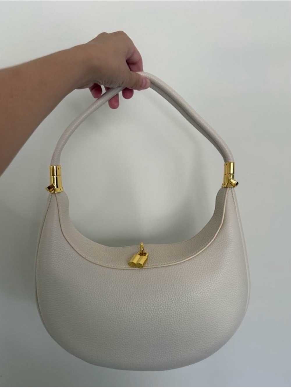 Cream Pebbled Leather Crescent Crossbody with Gold Accents